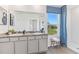 Bathroom with double vanity, granite countertop, and a walk-in shower at 36101 Sunflower Hill Dr, Zephyrhills, FL 33541