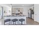 Modern kitchen with island, granite countertops, and stainless steel appliances at 36101 Sunflower Hill Dr, Zephyrhills, FL 33541