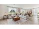 Spacious living room with neutral decor and plenty of natural light at 36101 Sunflower Hill Dr, Zephyrhills, FL 33541