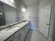 Main bathroom with granite countertops and a walk in shower at 36191 Trinity Glade Rd, Dade City, FL 33525