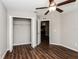 Bedroom with laminate flooring, ceiling fan, and access to another room at 3843 Laslo Ave, North Port, FL 34287