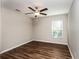 Bedroom featuring wood-look floors and a window with blinds at 3843 Laslo Ave, North Port, FL 34287
