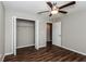 Bright bedroom with ceiling fan and laminate wood flooring at 3843 Laslo Ave, North Port, FL 34287