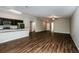 Modern kitchen with dark cabinetry, stainless steel appliances, and breakfast bar at 3843 Laslo Ave, North Port, FL 34287