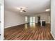 Spacious living room featuring wood-look flooring and sliding glass doors at 3843 Laslo Ave, North Port, FL 34287
