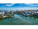 Aerial view of waterfront homes with private docks and boats at 443 Pinellas Bayway S # 105, Tierra Verde, FL 33715