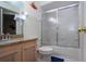 Small bathroom with shower and granite vanity at 443 Pinellas Bayway S # 105, Tierra Verde, FL 33715