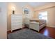 Bedroom with white twin bed and dresser at 443 Pinellas Bayway S # 105, Tierra Verde, FL 33715