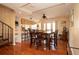 Bright dining room with wood floors and spiral staircase at 443 Pinellas Bayway S # 105, Tierra Verde, FL 33715