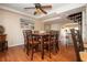 Charming dining room with hardwood floors and a wood table at 443 Pinellas Bayway S # 105, Tierra Verde, FL 33715