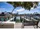 Private dock with seating, offering scenic waterfront views at 443 Pinellas Bayway S # 105, Tierra Verde, FL 33715