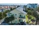 Yellow townhouse with balcony overlooking the waterfront at 443 Pinellas Bayway S # 105, Tierra Verde, FL 33715