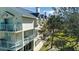 Townhouse building with balconies and lush landscaping at 443 Pinellas Bayway S # 105, Tierra Verde, FL 33715