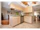 Updated kitchen with light wood cabinets at 443 Pinellas Bayway S # 105, Tierra Verde, FL 33715