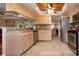 Bright kitchen with granite countertops and stainless steel appliances at 443 Pinellas Bayway S # 105, Tierra Verde, FL 33715