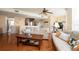 Light and airy living room with hardwood floors and a spiral staircase at 443 Pinellas Bayway S # 105, Tierra Verde, FL 33715