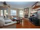 Spacious living room with fireplace and hardwood floors at 443 Pinellas Bayway S # 105, Tierra Verde, FL 33715