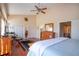 Main bedroom featuring a king-size bed and access to bathroom at 443 Pinellas Bayway S # 105, Tierra Verde, FL 33715