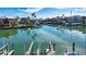 Stunning waterfront view with boats and lush landscaping at 443 Pinellas Bayway S # 105, Tierra Verde, FL 33715