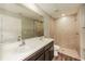 Bathroom with double vanity and large tiled shower at 5127 Tower St, North Port, FL 34291