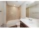 Clean bathroom with tub, single vanity, and tiled shower at 5127 Tower St, North Port, FL 34291