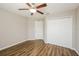 Bedroom with double door closet and ceiling fan at 5127 Tower St, North Port, FL 34291