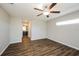 Spacious bedroom with ceiling fan and hardwood floors at 5127 Tower St, North Port, FL 34291