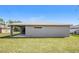Single-story home with covered patio and grassy yard at 5127 Tower St, North Port, FL 34291