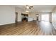Spacious living room with hardwood floors and access to patio at 5127 Tower St, North Port, FL 34291