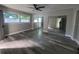 Spacious bedroom with mirrored closet doors and wood-look floors at 5198 40Th S St, St Petersburg, FL 33711
