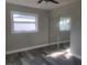 Spacious bedroom with mirrored closet doors and gray walls at 5198 40Th S St, St Petersburg, FL 33711