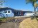 Ranch style home with newly painted blue exterior and a spacious driveway at 5198 40Th S St, St Petersburg, FL 33711