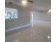 Open floor plan living area with a view of the kitchen and backyard at 5198 40Th S St, St Petersburg, FL 33711