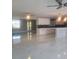 Open concept living area with marble-look floors and a view into the kitchen at 5198 40Th S St, St Petersburg, FL 33711