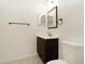 Bathroom with dark vanity, mirror and toilet at 5511 Legacy Crescent Pl # 204, Riverview, FL 33578