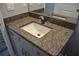 Bathroom vanity with granite countertop and single sink at 5575 113Th St, Seminole, FL 33772