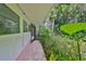 Side yard walkway leading to lush tropical landscaping at 5934 115Th Ln, Seminole, FL 33772