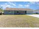 Home's backyard features a screened patio and grassy area at 7061 Denmark St, Englewood, FL 34224