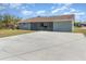 Large backyard with spacious concrete patio at 7061 Denmark St, Englewood, FL 34224