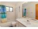 Clean bathroom with shower/tub combo and vanity at 7061 Denmark St, Englewood, FL 34224