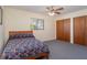 Bedroom with a double bed, ceiling fan, and double door closet at 7061 Denmark St, Englewood, FL 34224