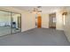 Bedroom with patio access and ceiling fan at 7061 Denmark St, Englewood, FL 34224