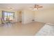 Small dining area with glass table and four chairs at 7061 Denmark St, Englewood, FL 34224
