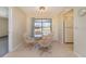 Simple dining area with glass table and four chairs at 7061 Denmark St, Englewood, FL 34224