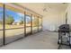 Screened patio with backyard view and ceiling fan at 7061 Denmark St, Englewood, FL 34224