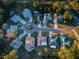 Aerial view of a residential neighborhood featuring well-maintained homes and manicured lawns at 7065 Sparkling Creek Ct, Spring Hill, FL 34606