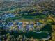Panoramic aerial view of the community, showcasing the golf course and residential area at 7065 Sparkling Creek Ct, Spring Hill, FL 34606