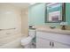 Cozy full bathroom featuring a tub, vanity and tile walls at 7065 Sparkling Creek Ct, Spring Hill, FL 34606
