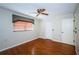 Spacious bedroom with wood floors and a closet at 7065 Sparkling Creek Ct, Spring Hill, FL 34606