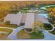 An aerial view of the beautiful community clubhouse overlooking the golf course and swimming pool at 7065 Sparkling Creek Ct, Spring Hill, FL 34606